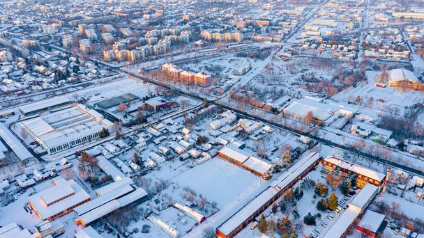 Aerial view is on the roofs of houses white of snow, frosty cityscape in the winter time.   - 写真・画像