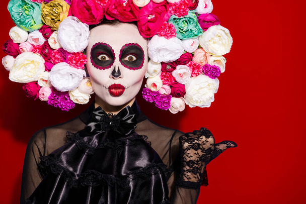 Closeup photo beauty crazy dead bride calavera lady face mask print, direct thumb empty space send kiss interesting novelty floral headband black dress isolated red color background. - 写真・画像