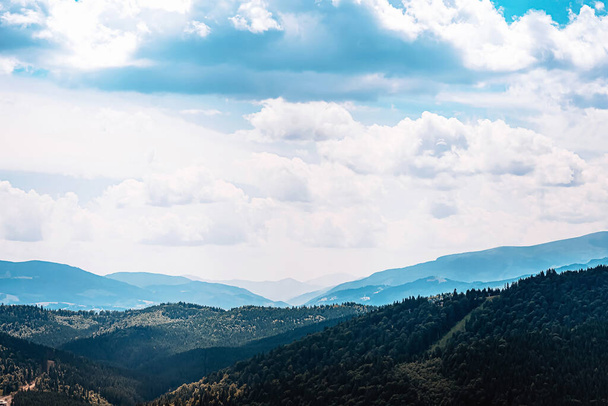Mountain range of the Ukrainian Carpathians in summer with a tonal perspective. High quality photo - Φωτογραφία, εικόνα