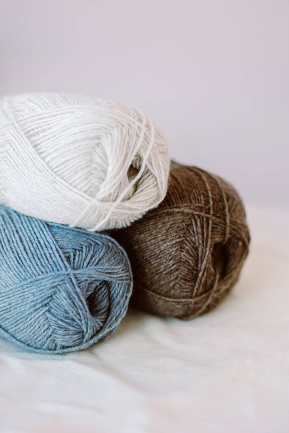 Skeins of woolen yarn for hand knitting. Natural colors. Concept for handmade. - Fotó, kép