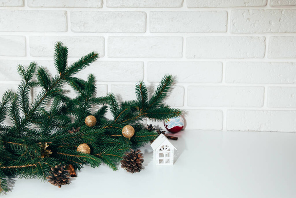 New Year, Christmas background. New Years decor on a white background with branches of a green Christmas tree, pine cones. Front view - Fotografie, Obrázek