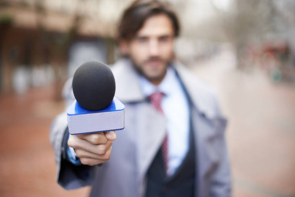 Would you like to comment. Blurred shot of a reporter conducting an interview - Foto, Imagem
