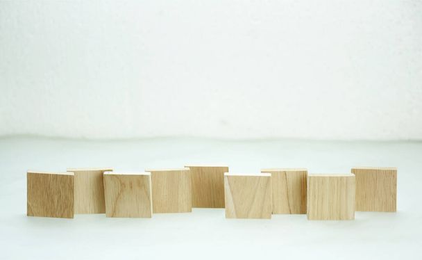 cubes of wood on white background - 写真・画像