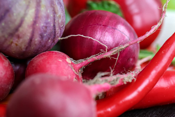 Macro shot, raw radish among other vegetables, organic and natural products concept. - Foto, afbeelding