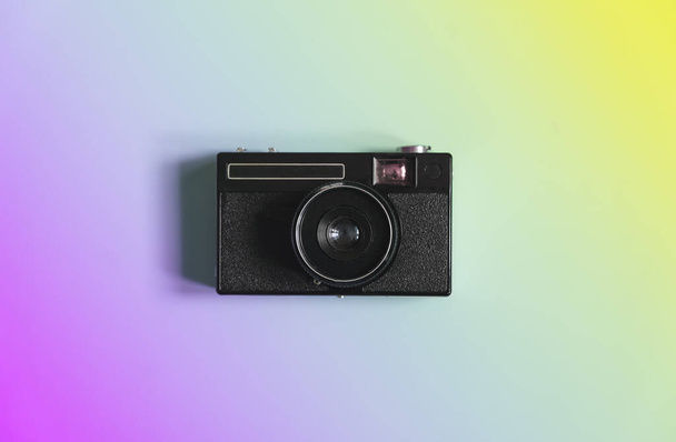 Vintage film camera on a color minimal background. Photography, hipster lifestyle concept. High quality photo - Foto, Imagem