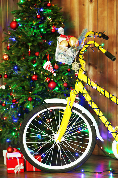 Bicycle near Christmas tree - Photo, Image