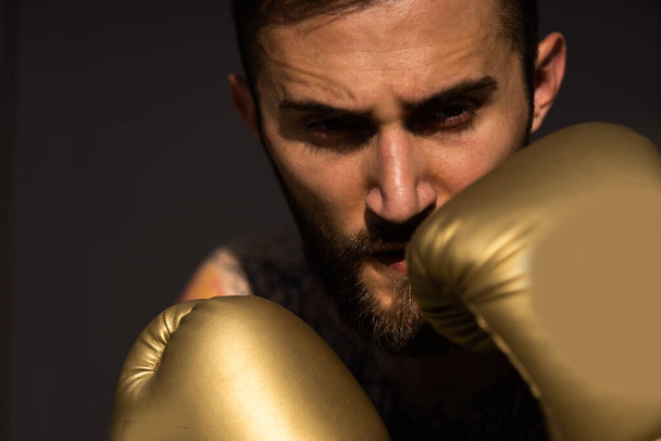 Part of man wearing boxing gloves - Zdjęcie, obraz