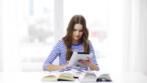 smiling student girl with tablet pc and books - Materiaali, video