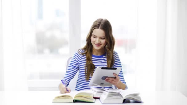 smiling student girl with tablet pc and books - Video, Çekim