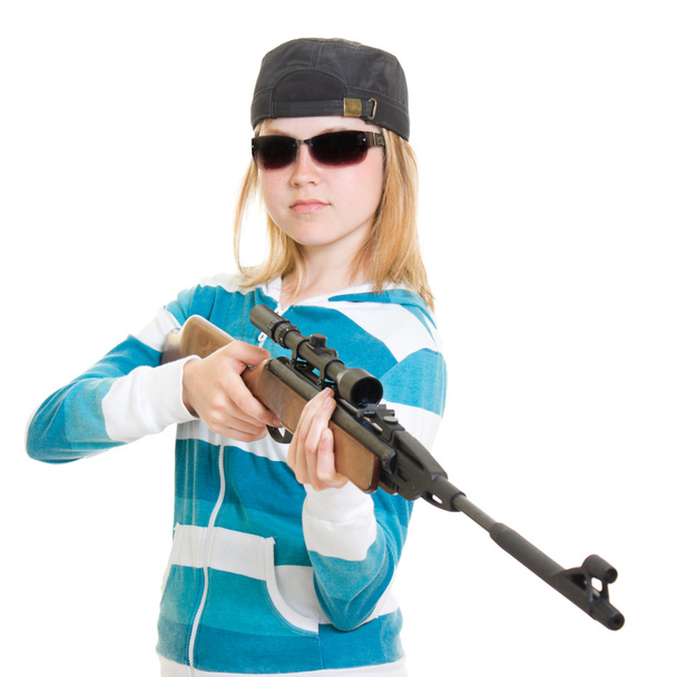 A teenager with a gun on a white background. - Fotografie, Obrázek