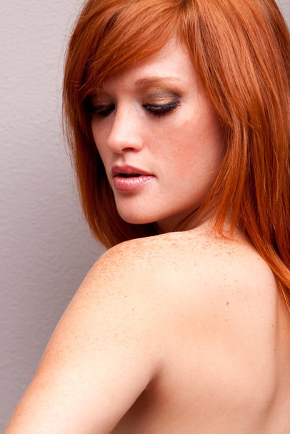 Young woman with long red hair - Foto, Imagen