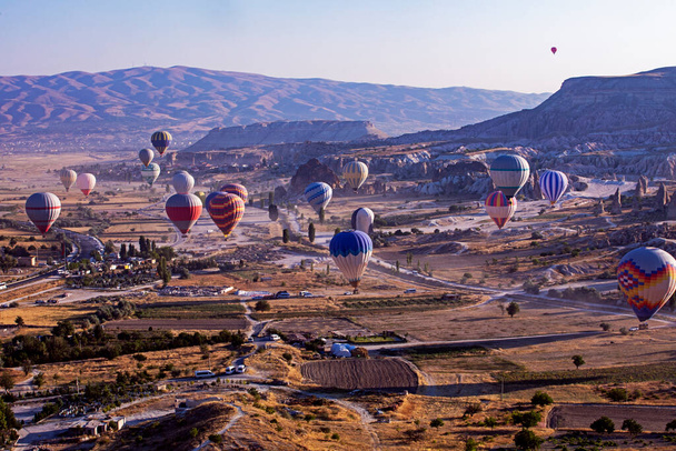 beautiful view of the flight of hot air balloons in the early morning in Cappadocia - Photo, Image
