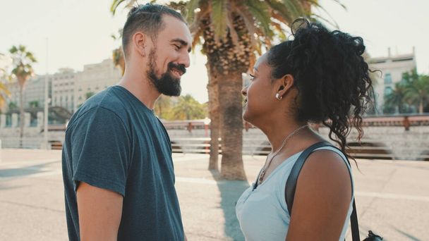 Happy interracial couple looking at each other - Fotografie, Obrázek