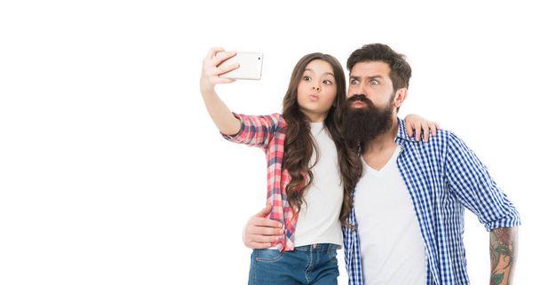 Happy family. Sharing ideas and having fun. Capture happy moments together. Happy little girl with father. Little child cheerful dad. Father and daughter taking selfie. Teens interests. Technology. - Foto, Bild