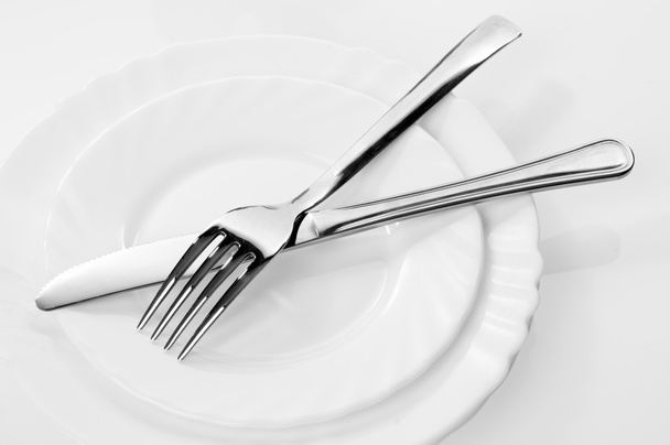 Knife and fork on a plate - Photo, image