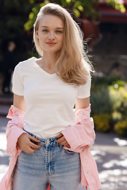 young pretty blond woman outdoor. High quality photo - Фото, зображення