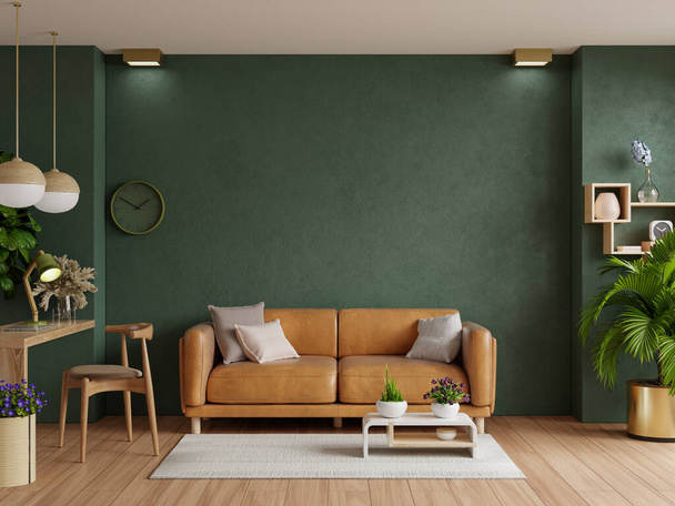 革のソファと空の濃い緑の壁の背景に装飾部屋と光の部屋。 - 写真・画像