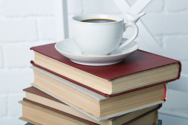 Pile of books with cup - Foto, Imagen
