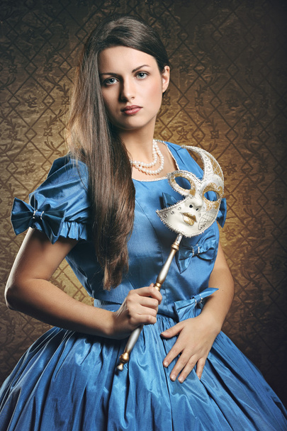Beautiful woman with blue dress and venetian mask - Fotoğraf, Görsel