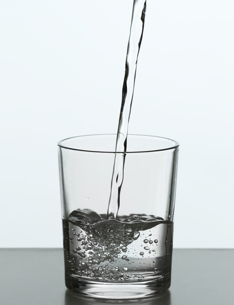 Pouring water from bottle - Foto, imagen