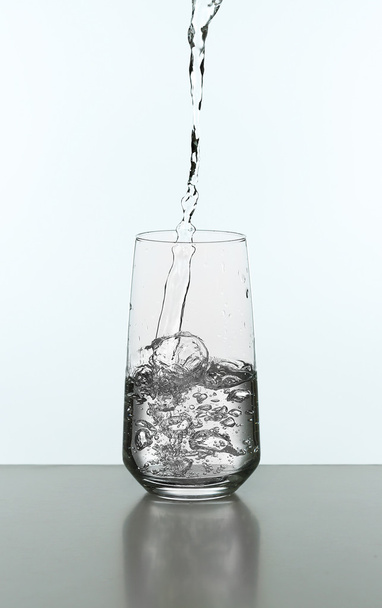 Pouring water from bottle - Foto, Imagem