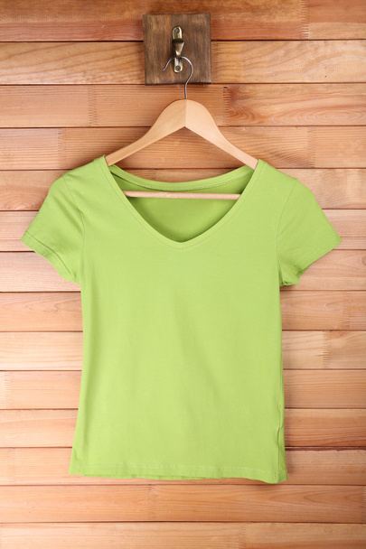 Female t-shirt on hanger - Fotografie, Obrázek