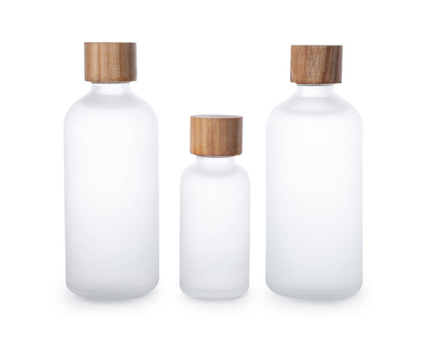 Bottles of essential oil on white background - Fotó, kép