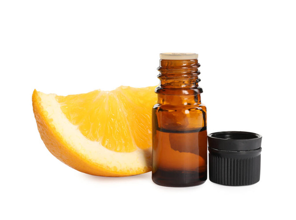Bottle of citrus essential oil and fresh orange slice on white background - Photo, image
