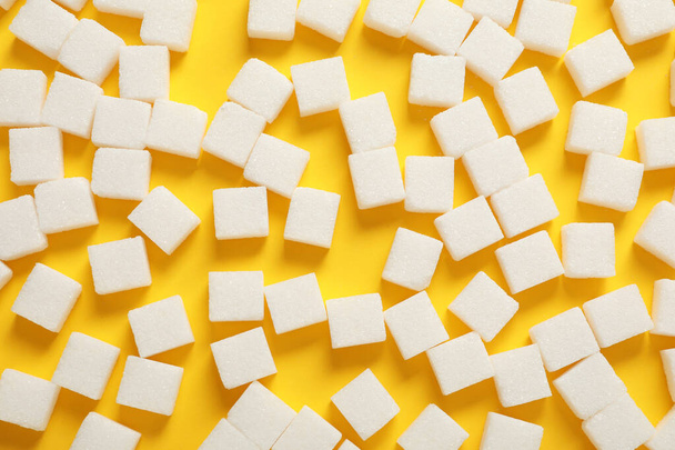 White sugar cubes on yellow background, flat lay - Photo, Image