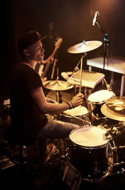 A talented drummer playing drums at a show. This concert was created for the sole purpose of this photo shoot, featuring 300 models and 3 live bands. All people in this shoot are model released - Foto, immagini