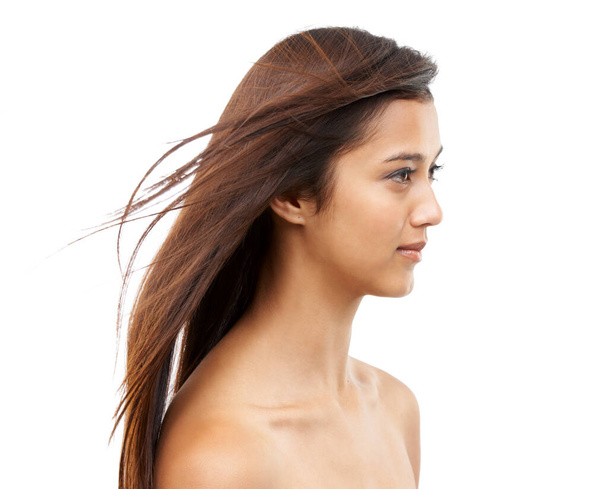 Super sleek and silky. A young woman with shiny hair against a white background - Photo, image