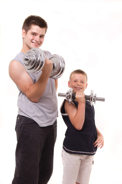 Man and son exercise at gym - Foto, Imagem