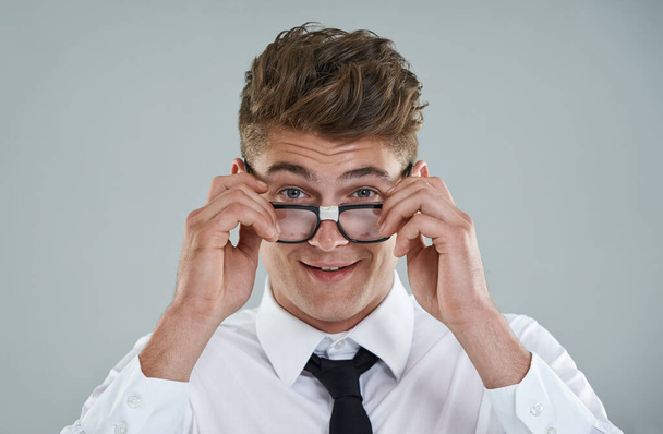 Business is not all serious. A young businessman with nerdy glasses - Foto, Imagen