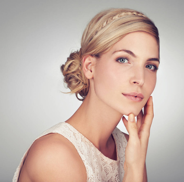 Elegant beauty. Head and shoulders portrait of a beautiful young woman - Фото, изображение