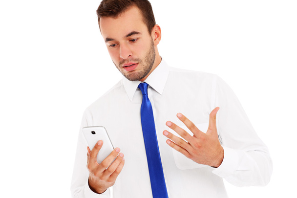 Angry businessman with a phone - Photo, Image