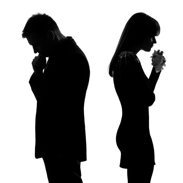 one sad couple back to back man thinking and woman crying silhou - Фото, изображение