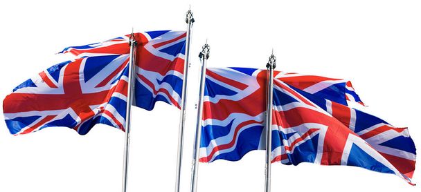 Union Jack Flags. Collection de quatre drapeaux nationaux britanniques avec mât de drapeau, soufflant dans le vent, isolés sur fond blanc. Deux couples, Photographie. - Photo, image