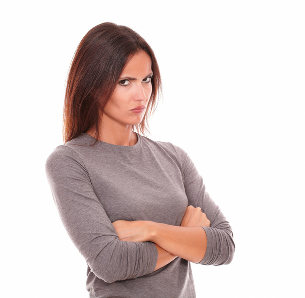 Unhappy brunette in grey blouse looking angry - Foto, Bild