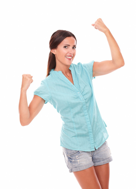 Happy hispanic girl in blue shirt with arm up - Foto, Imagem
