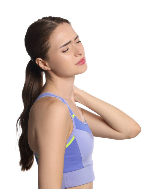 Young woman suffering from neck pain on white background - Φωτογραφία, εικόνα