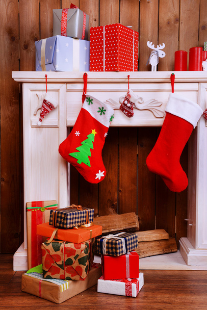 Fireplace with Christmas gifts - Фото, зображення