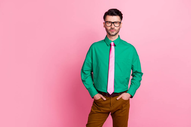 Photo of good looking man dressed fashionable green shirt trendy outfit go date empty space isolated on pink color background. - Photo, Image