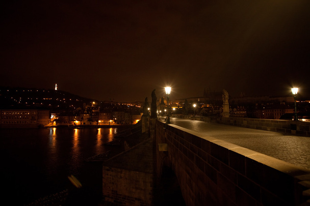 A beautiful night view of the Charles Bridge in Prague - Foto, afbeelding