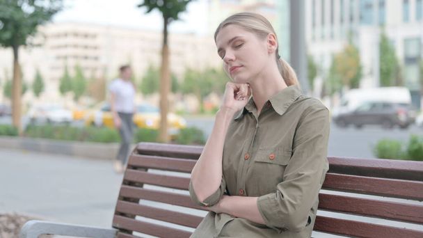 Tired Young Woman Sleeping while Sitting Outdoor on Bench - Foto, Imagem