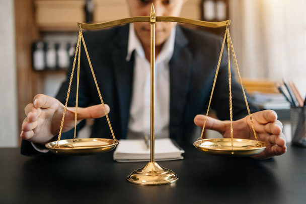 Male lawyer in office at desk table with brass scale. justice and law concept - Foto, Imagem