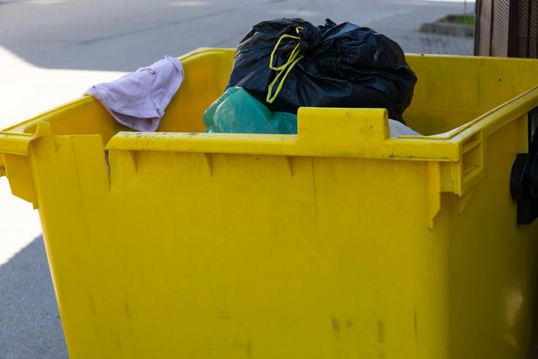 Close up picture of trash bin full of garbage on the street - Φωτογραφία, εικόνα