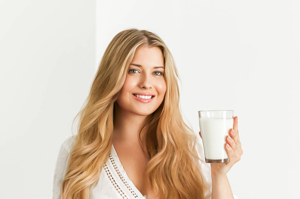 Diet, health and wellness concept, woman holding glass of milk or protein shake cocktail - Zdjęcie, obraz