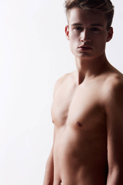 Alluring and desirable. Studio shot of young attractive male baring his chest - Fotoğraf, Görsel