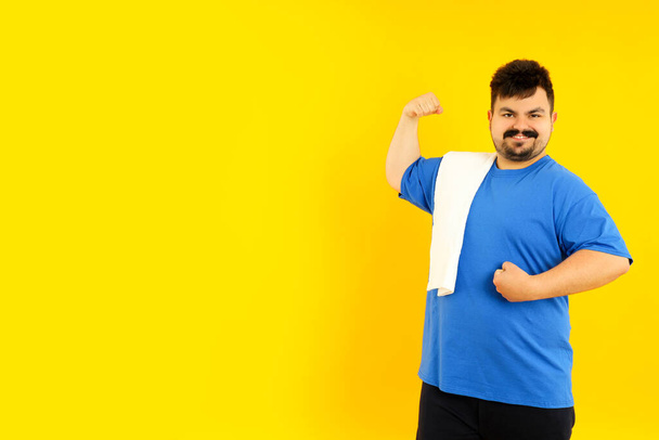 Concept of people, young fat man on yellow background - Φωτογραφία, εικόνα