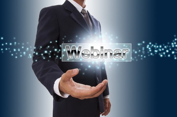 Businessman hand showing webinar button on virtual screen. - Φωτογραφία, εικόνα